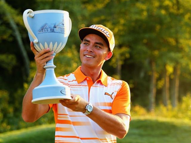 Rickie Fowler celebrates with the Deutsche Bank Championship trophy